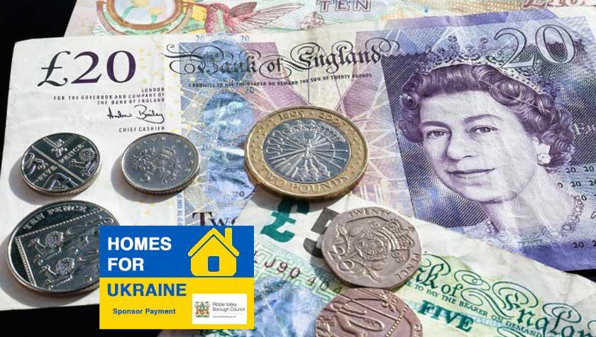 Image of £20 note and a £10 note alongside some loose change