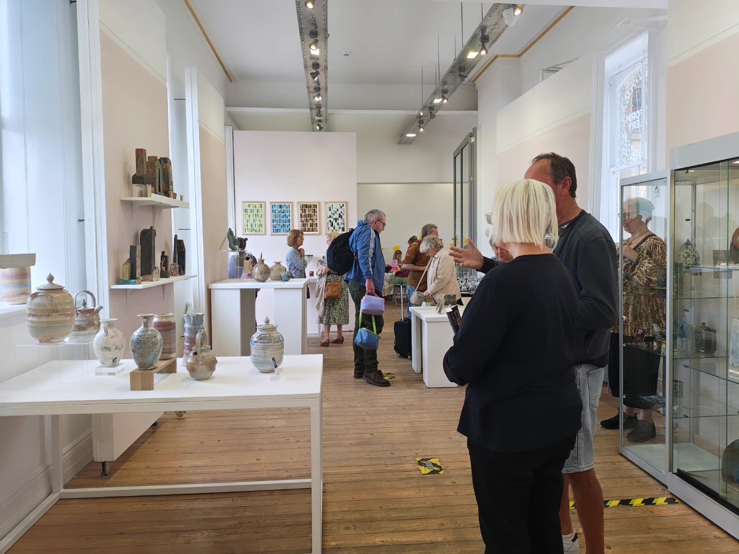 People looking at clay exhibits at the launch event for Clay North Now and the Platform Gallery Clitheroe