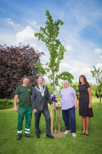 Mayor and staff with some of the trees