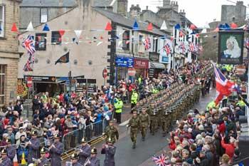 Image of Clitheroe Town Centre showing a parade of soldiers.