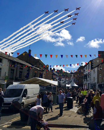 Red arrows fly over