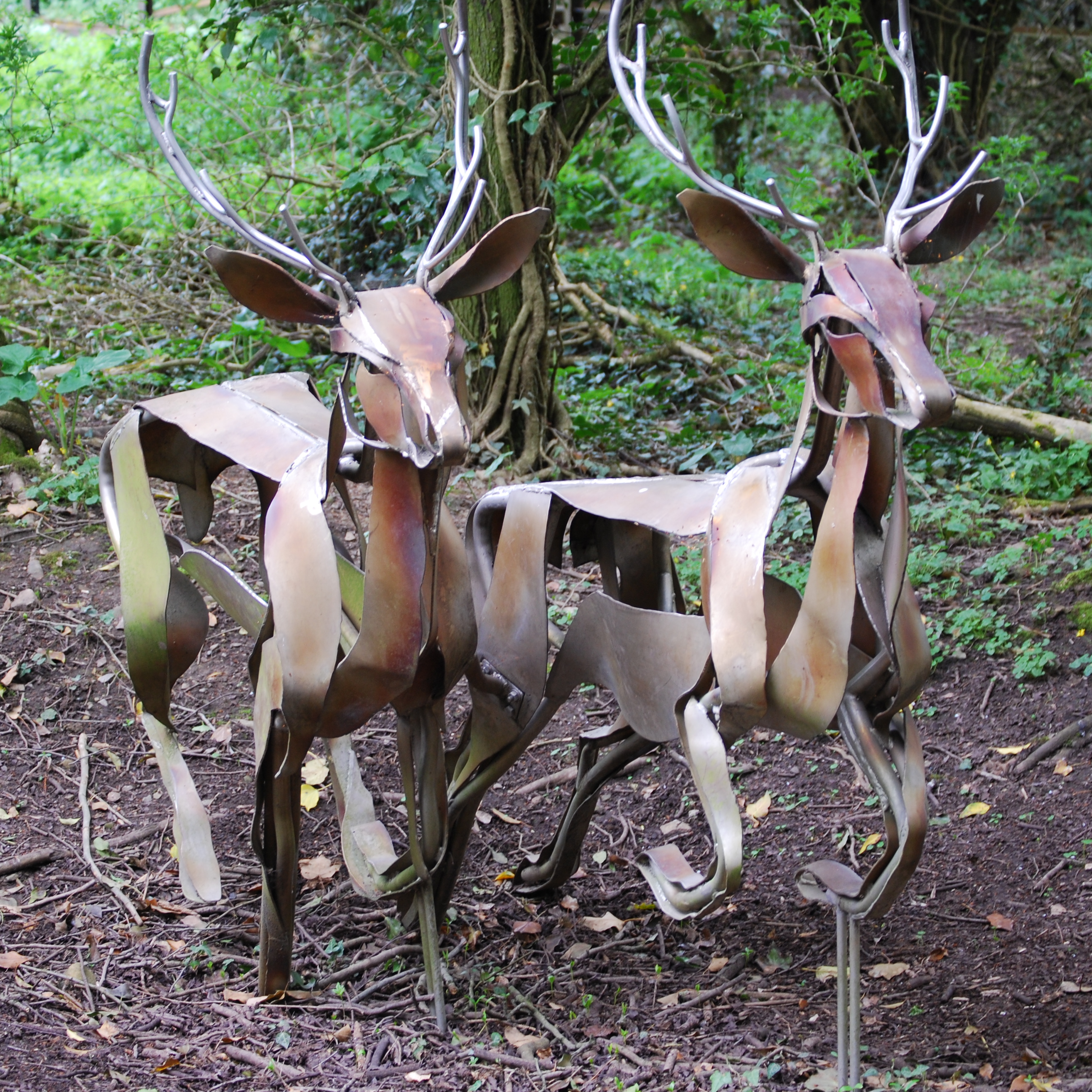 Two artworks made of metal representing deer