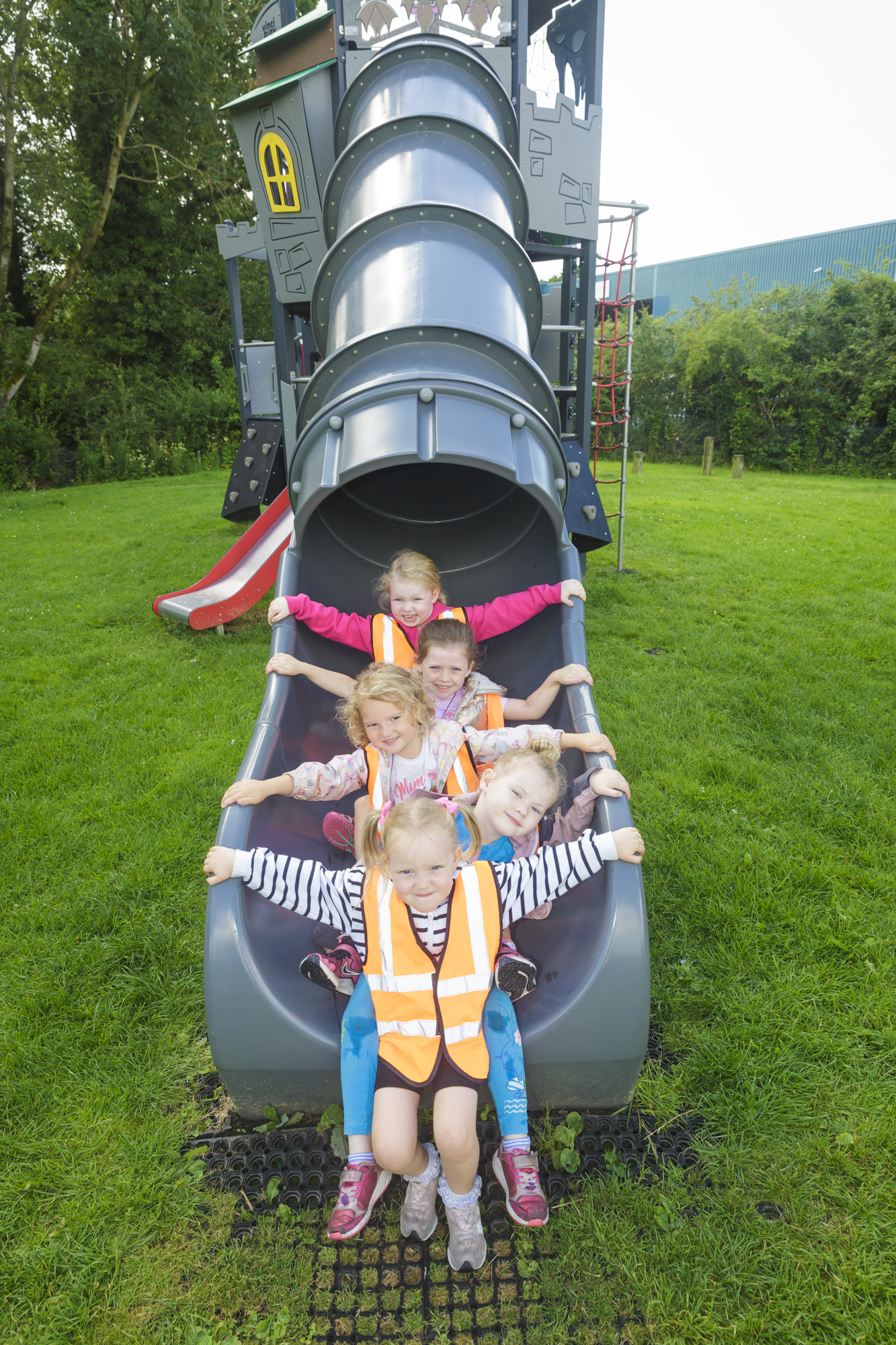 Nursery school pupils on a new slide