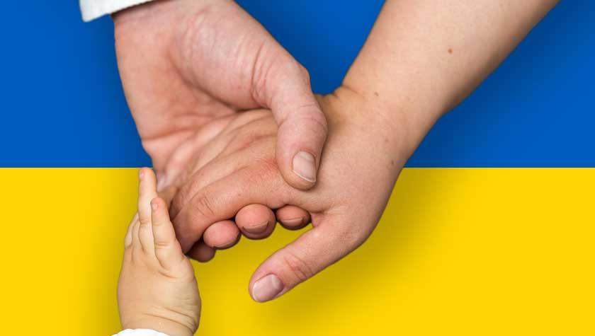 Holding hands over the Ukrainian Flag