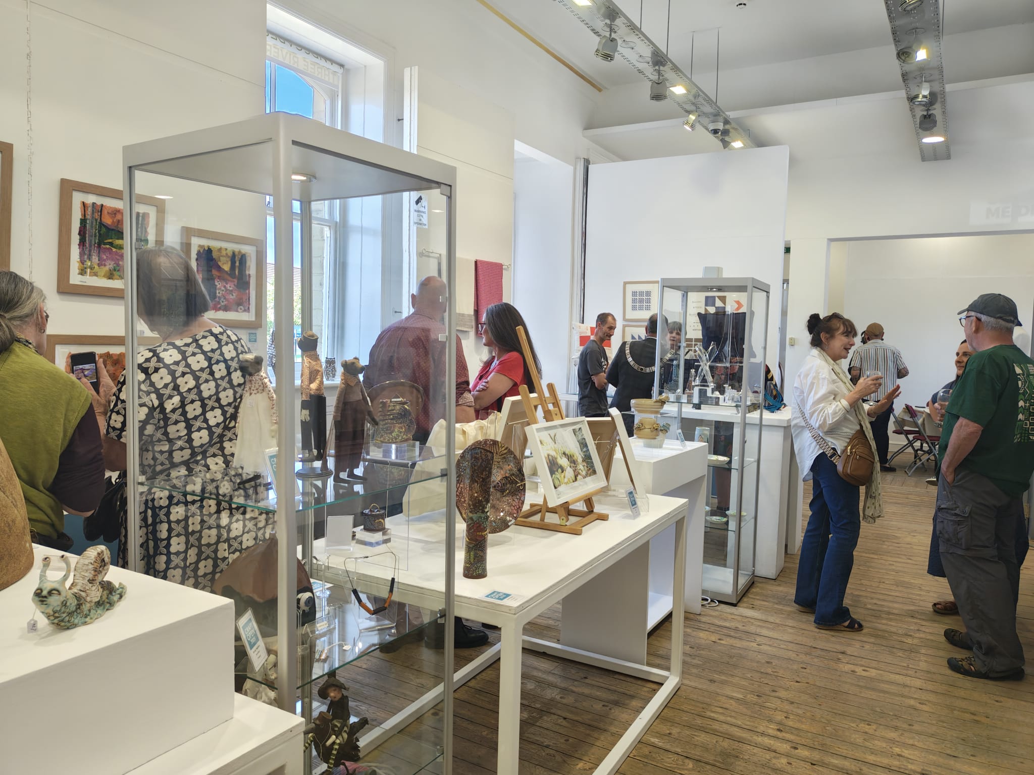 Photo of several members of the general public browsing the Platform Gallery craft open 2025