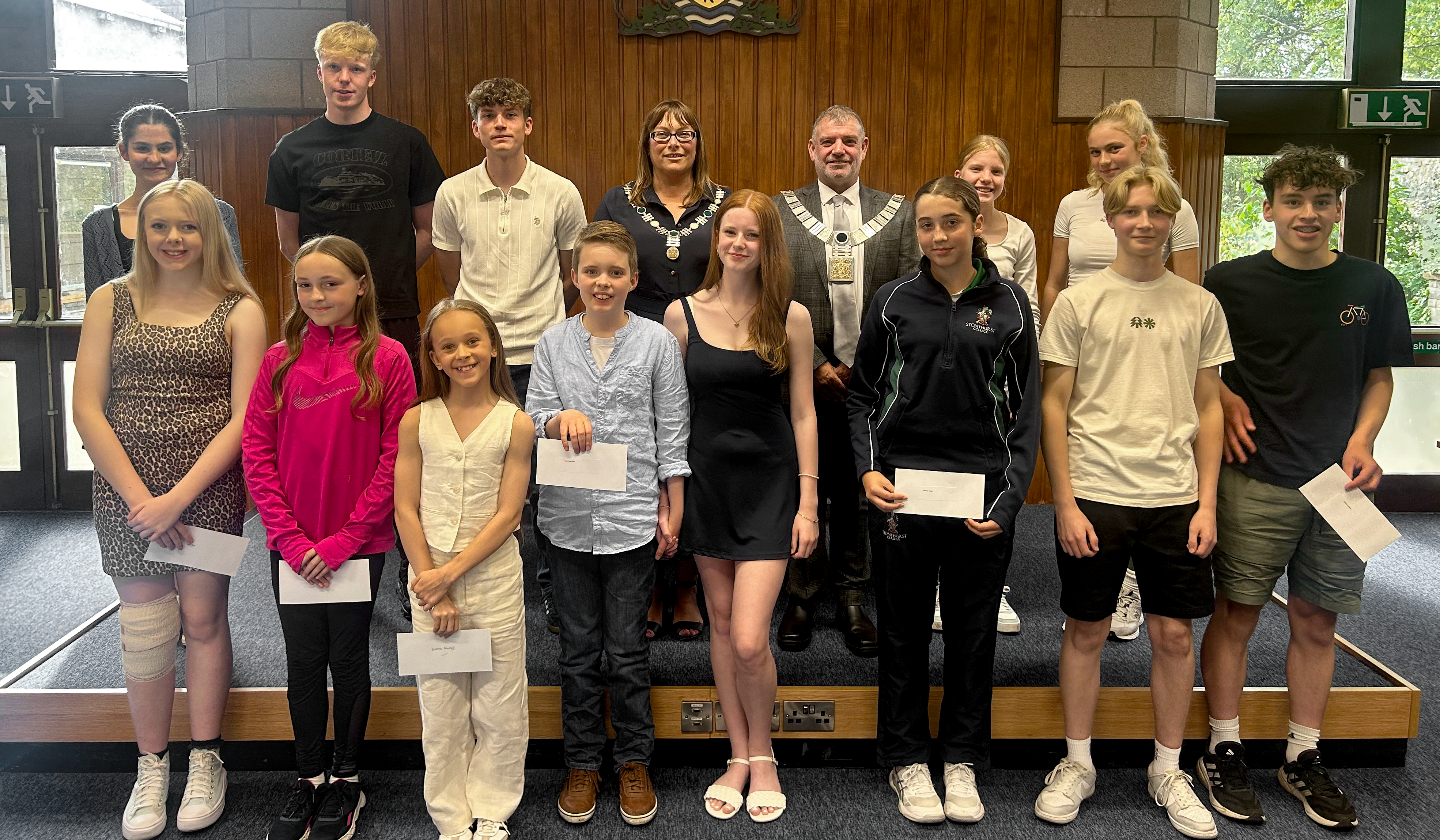 Young people lined up next to the mayor and mayoress after receiving their grants